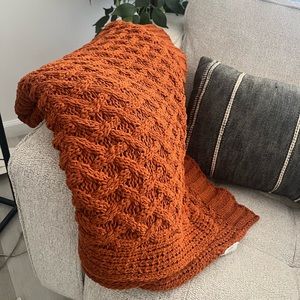 Orange/brown throw blanket